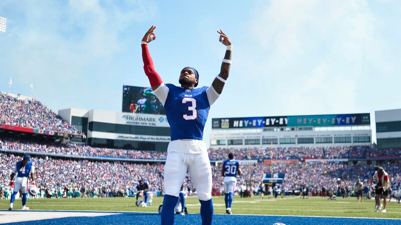 Buffalo Bills safety Damar Hamlin (3) raises his arms while warming up prior to an NFL...